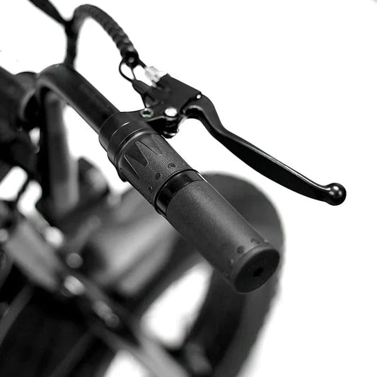 Side view of the eMOTO eBike Strike Big Boy electric bicycle, showcasing its sturdy frame, large tires, and battery pack mounted on the downtube.