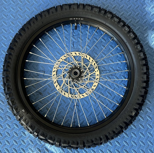 eMoto Shinko 244 Dual Sport 19" front wheel and tire set for eMoto bikes, available at eBike Super Shop, designed for superior traction and durability on both off-road trails and on-road surfaces, providing smooth performance across diverse terrains.