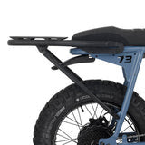 Rear view of a Super73 S-Series eBike equipped with a black rear rack attachment.