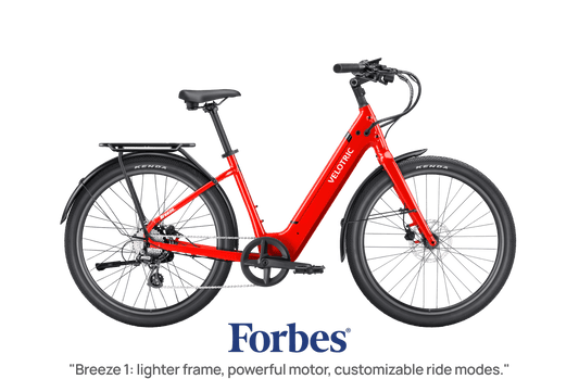 Red Velotric Breeze 1 eBike in classic scarlet color, side view, isolated on white background