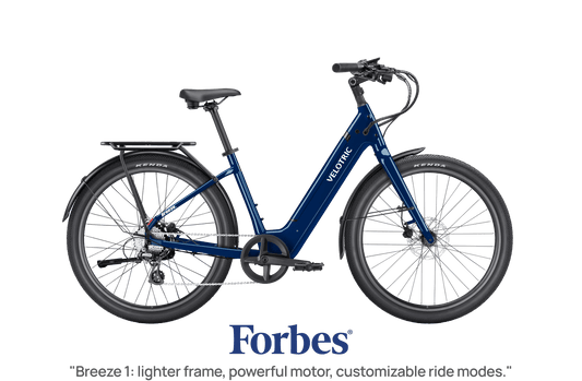 Velotric Breeze 1 electric bike in Lemans Blue, side view, against a white background