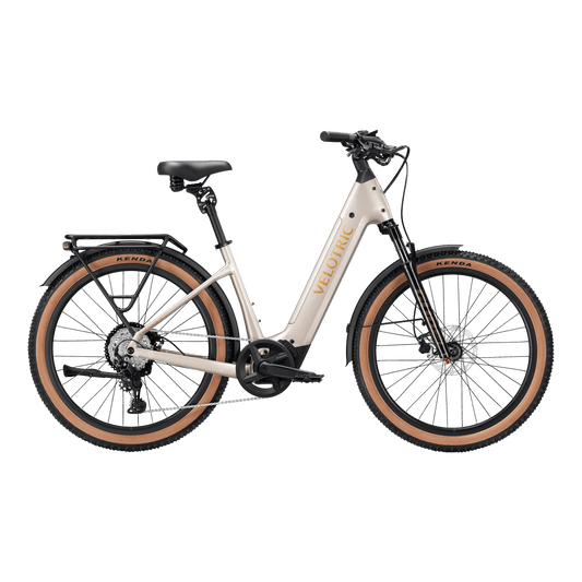 Platinum Silver Velotric Discover M eBike side view, showcasing step-through frame, front suspension fork, and rear rack