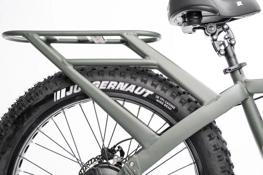 Side view of a QuietKat Ranger AWD 750w Step Over eBike with 26x4.5 fat tires, showcasing its rugged electric mountain bike design against a plain background.