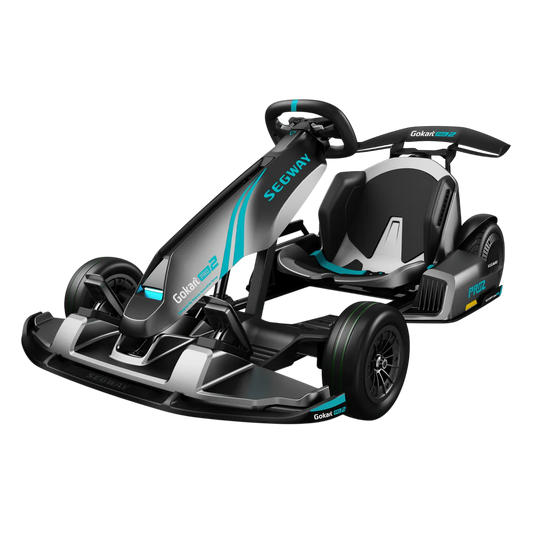 Side view of the eMOTO Segway Gokart PRO 2, showcasing its sleek black and green design, sturdy frame, and sporty wheels against a plain background.