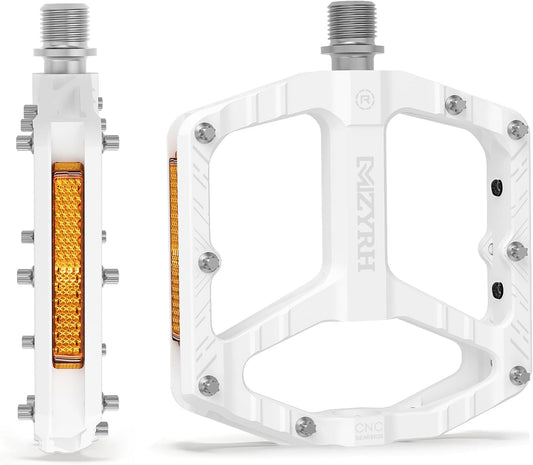 White alloy eBike pedals with reflectors, product image on white background