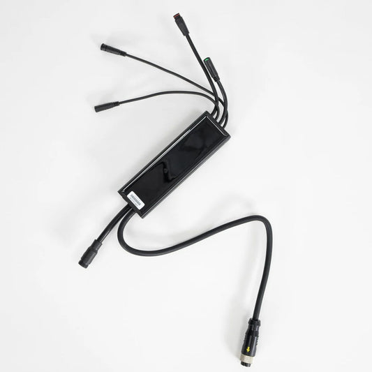 Close-up view of a Super73 S-Series electric bike controller, showing wiring connections and electronic components.