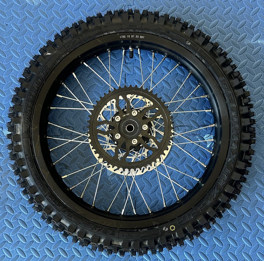 eMoto CST Knobby 17" rear wheel and tire set for eMoto electric dirt bikes, designed for enhanced traction and durability, providing reliable performance on rugged off-road trails and tough terrains.