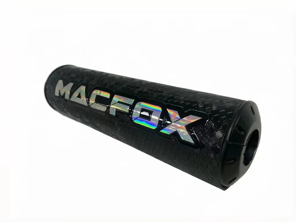 A black Macfox universal eBike bar pad with white logo, shown mounted on handlebars.