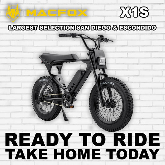 Black Macfox X1S eBike side view, showcasing sleek frame design and rugged tires, set against a neutral background.