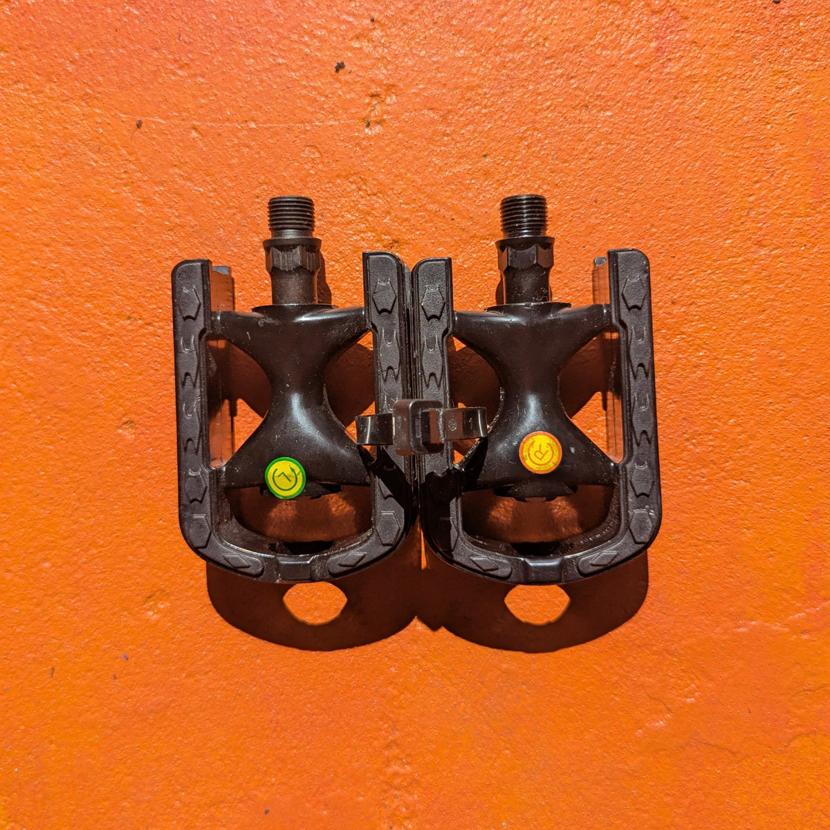 Close-up view of metal eBike pedals in Style 6, showcasing a sturdy, textured surface and a modern, angular design.