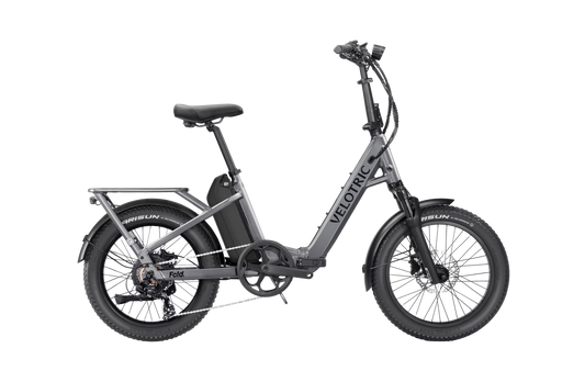 Velotric Fold 1 Plus eBike in Stone Gray, side view, folded compactly for portability