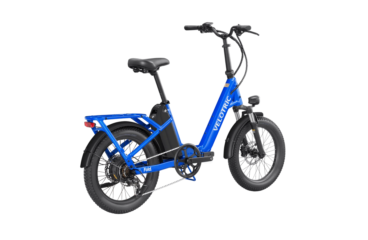 Electric blue Velotric Fold 1 eBike, folded for compact storage, showcasing its sleek design and portability.