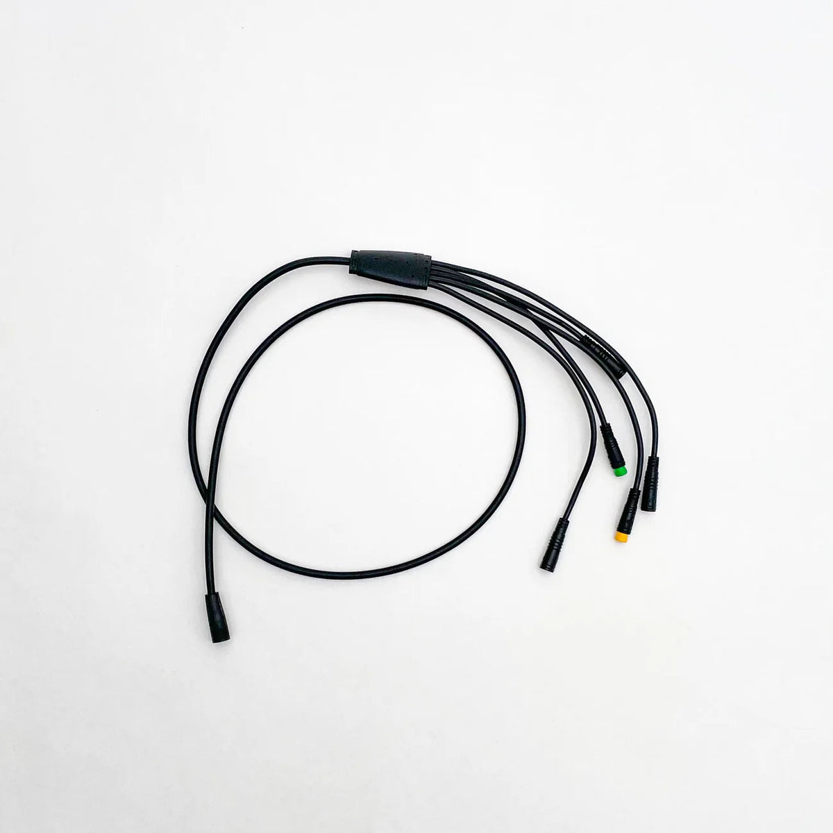 Close-up view of a Super73 R/RX/S2 e-bike wiring harness, showing multiple colored wires, connectors, and plugs arranged for electrical connections.