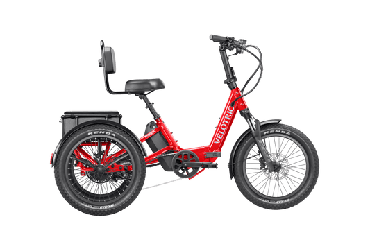 A cherry crimson Velotric Triker eTrike shown from the side, highlighting its three-wheel design and modern frame.