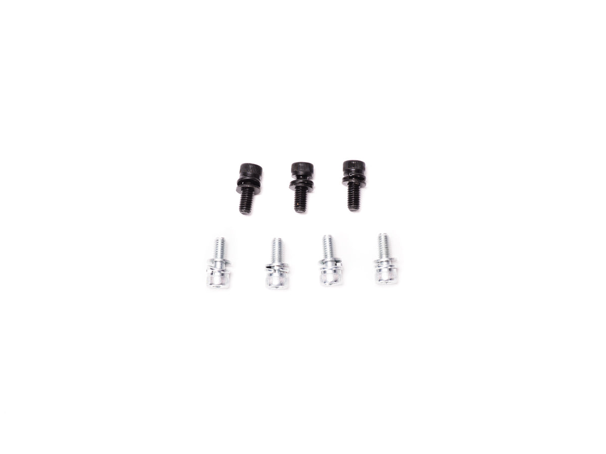 Stomp Ebox Dragster Motor Mounting Kit components arranged on a white background, including metal brackets, bolts, and mounting hardware.