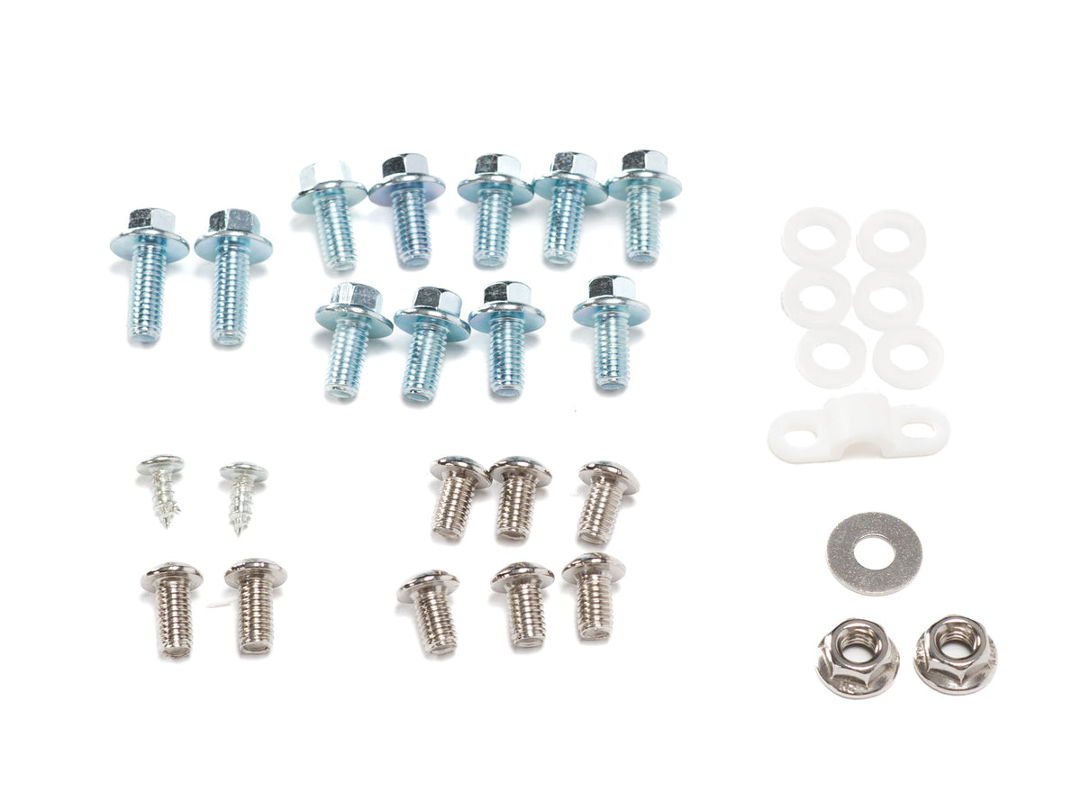 Stomp Ebox Plastics Fitting Kit components arranged on a white background, including various plastic fittings, screws, and mounting hardware.