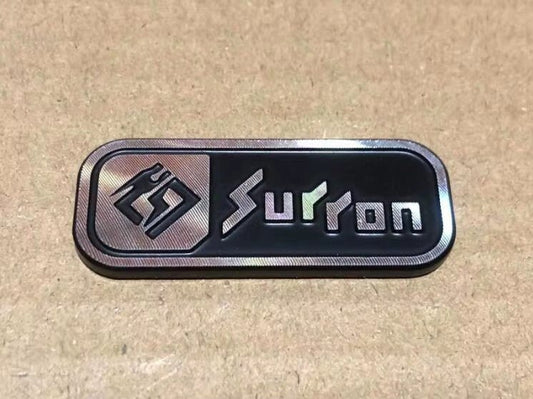 Surron Logo Badge - physical - sku - 49597339205918 eBike Super Shop