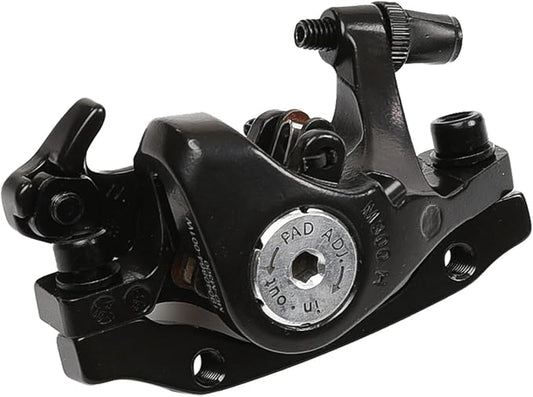 Close-up of a Tektro bicycle brake lever mounted on a handlebar, showing the black metal lever and adjustment screw.